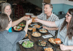 People enjoying a meal and beverages at Pedal Pusher's Cafe in Lanesboro